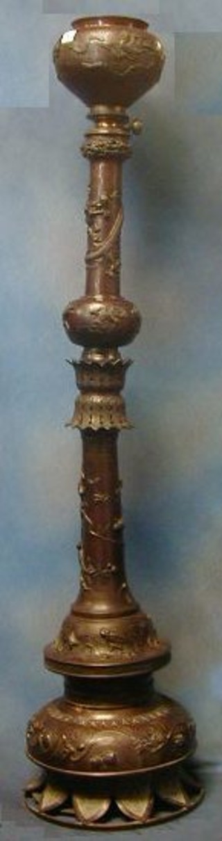 An impressive 19th Century Oriental bronze oil lamp reservoir raised on a cast bronze column, decorated dragons, birds amidst flowering branches etc, etc, 58" 