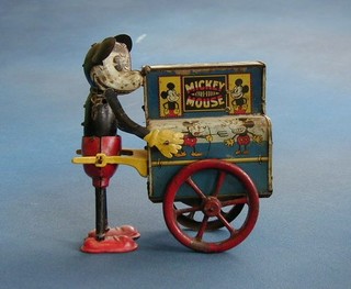 A 1952 tin plate toy of Mickey Mouse with a Barrel Organ (miniature Mickey from top of organ missing)