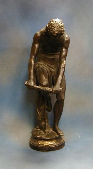 After Chambord, a cast bronze figure of a standing wood cutter breaking a bundle of sticks,  the base marked Le Bucheron Fable de la Fontaine, raised on a circular base 34"  