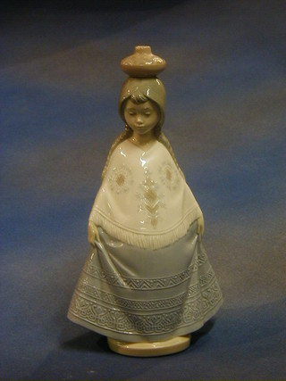A Nao figure of a standing girl with pot on her head, the base marked Nao 346P 11"