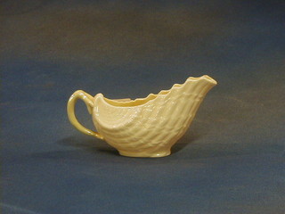A Beleek porcelain sauce boat, the base with green mark and RD No. 0857 7"