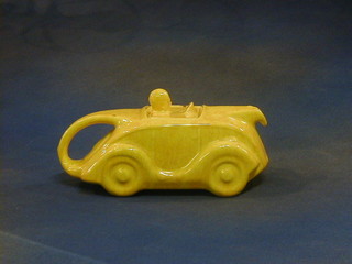 A Sadler yellow glazed pottery teapot in the form of a racing car (2 slight chips to rim)