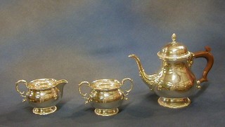 A Georgian style 3 piece silver tea service of baluster form with gadrooned borders, comprising teapot, cream jug and hotwater jug Birmingham 1963 29ozs 