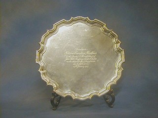 A silver salver with bracketed border, raised on 3 scrolled supports, inscribed, Sheffield 1924, by Walker & Hall 16" 54 ozs  