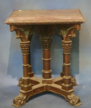 A Victorian carved oak Gothic style centre table with inlaid carved marquetry top, raised on 5 turned column supports with vinery capitals 23" 