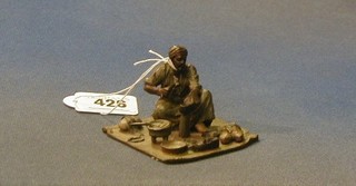 An Austrian cold painted bronze figure of an Eastern shoe repairer, 2"