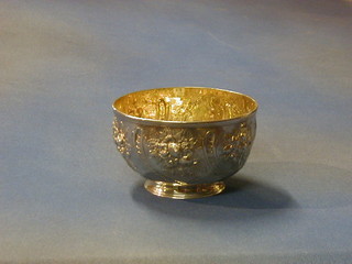 A Victorian embossed silver pedestal bowl with parcel gilt interior, London 1877