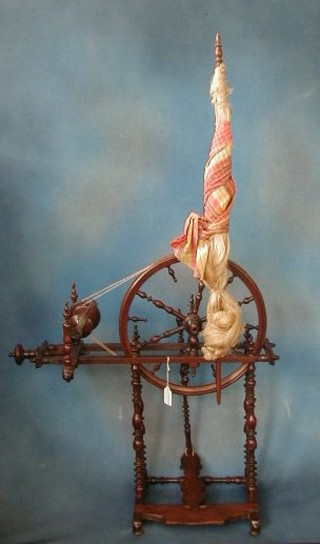 An 18th Century turned mahogany drawing room spinning wheel