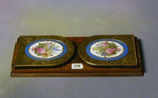 A pair of Victorian figured walnutwood expanding book ends with "Sevres" porcelain plaques with gilt metal mounts 16"