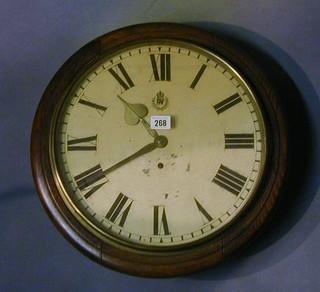 A Royal Air Force wall clock, the 14" painted dial with Roman Numerals and RAF crest, having brass handles, contained in an oak case 