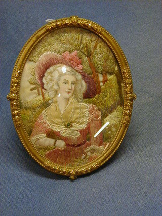 A portrait miniature of a crinoline lady contained in an oval gilt frame 5" oval