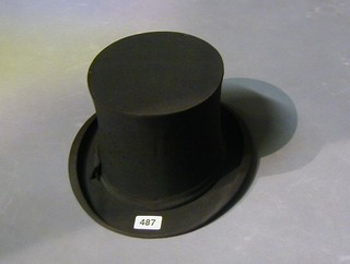 A gentleman's folding opera hat by Tress & Co.