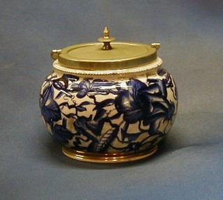 A circular Victorian pottery biscuit barrel with plated mounts