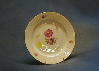 A KPM 6 piece dessert service comprising 2 large circular plates and 4 small plates with ribbon ware borders and floral decoration