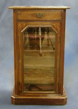 A Victorian figured and inlaid walnutwood music  cabinet fitted a drawer above a cupboard enclosed by a glazed panelled door 21"