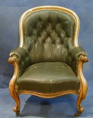 A Victorian bleached mahogany show frame tub back armchair upholstered brown buttoned rexine and on French cabriole supports   