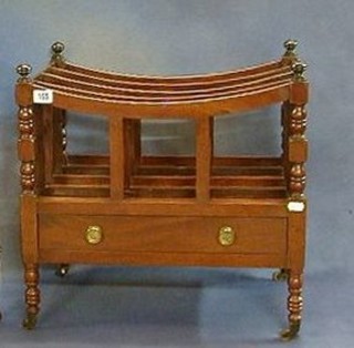 A 19th Century mahogany 4 division Canterbury raised on turned supports, the base fitted a drawer 19"   