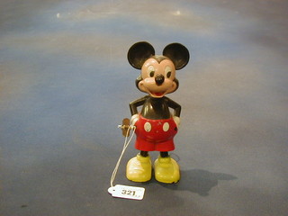 A plastic wind up figure of Mickey Mouse