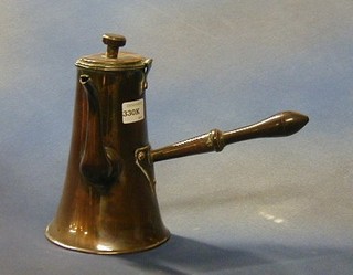 A 17th/18th Century copper side handled coffee pot with turned wooden handle