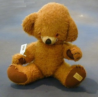 A Merrythought teddybear, the head fitted a bell