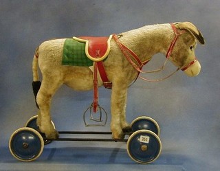 A childs 1950's Steiff push-a-long figure of a donkey with working bray  