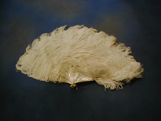 A ladies mother of pearl and white ostrich feather fan and a pair of pince nez