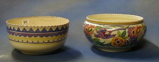 A circular Poole pottery fruit bowl decorated birds amidst flowering branches incised 965 and impressed Poole England 9" (cracked) and 1 other Poole pottery bowl with geometric design, the base impressed Carter Stabler Adams Pool 10" (cracked)