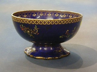 A Carltonware blue glazed lustre pedestal bowl decorated butterflies, the base marked RD No. 661633 9" (cracked)