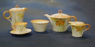 A 24 piece Shelley tea service comprising teapot, hotwater jug, sugar bowl, cream jug, 6 cups (1 cracked) and 6 saucers (1 cracked), teapot stand, twin handled bread plate, 6 tea plates (1 slightly rubbed), the bases marked Shelley England RD No. 781613 and marked W12382 (with a 1 under the 2) and also marked Lawleys Regent Street 