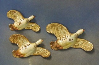 3 Beswick pottery wall mounting graduated flying Red Legged Grouse, the backs marked Beswick England 1188/1