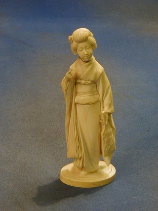 A fine quality 19th Century Oriental carved ivory figure of a Geisha girl with fan, the with signature mark 8 1/2" high