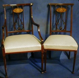 An Edwardian inlaid mahogany 7 piece drawing room suite comprising 2 open arm chairs, a 2 seat settee and 4 standard chairs with pierced splat backs, inlaid throughout and raised on square tapering supports 