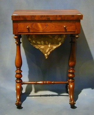 A William IV rosewood games table/work box the top inlaid a chess, backgammon and cribbage board, the base fitted 1 drawer above a basket raised on turned supports united by an H framed stretcher 20"