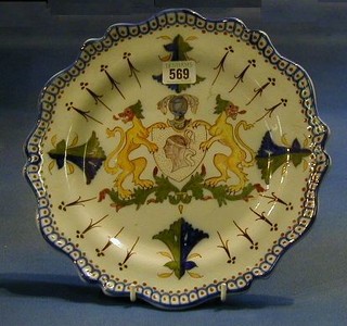 A Desvres pottery plate with armorial decoration 11"