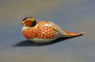 A Royal Crown Derby porcelain figure of a seated pheasant, the base marked XL1X