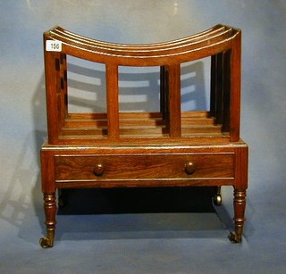 A 19th Century rosewood 3 division Canterbury the base fitted a drawer and raised on turned supports 17"