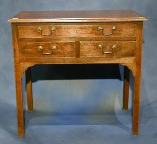 A Georgian mahogany side table fitted 1 long and 2 short drawers raised on square supports 32"