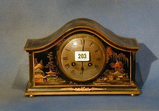 A 1930's 8 day chiming mantel clock with silvered dial and Roman numerals, contained in an arched lacquered case with chinoiserie decoration