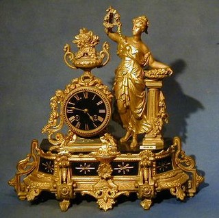 A 19th Century French 8 day striking mantel clock contained in a gilt spelter case supported by a figure of a maiden