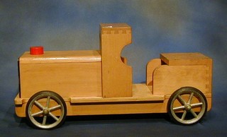 A childs beech framed push a long model locomotive