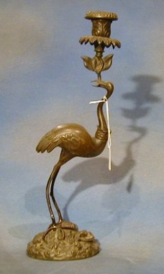 A 19th Century Eastern bronze candlestick in the form of a stork 16"