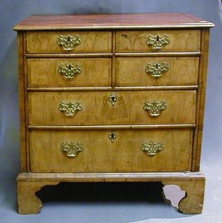 A Queen Anne walnutwood chest with crossbanded top above 4 short and 2 long drawers, raised on bracket feet 32"