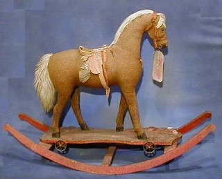 A 19th Century push-a-long rocking horse now raised on rockers (reputedly the property of the Belgium Royal Family - see attached note)