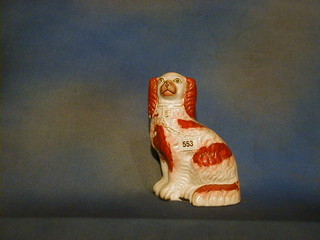 A 19th Century Staffordshire seated figure of a Spaniel 9" (slight crack to front)