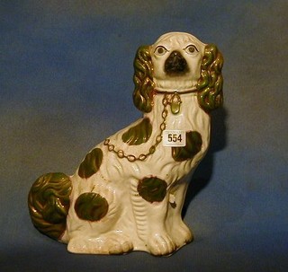 A Victorian figure of a seated Staffordshire Spaniel 13" high