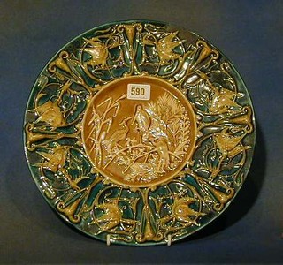 A Continental circular Majolica plate decorated storks the base impressed 584 V Chutz Lamski  13"