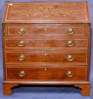 A fine quality Edwardian mahogany bureau, inlaid satinwood and ebonised stringing throughout, the fall front revealing a well fitted interior above 4 long drawers raised on bracket feet by Edwards & Roberts 39" 