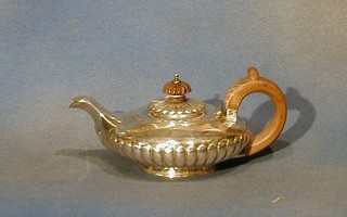 A George III circular silver teapot with demi-reeded decoration London 1821 9 ozs