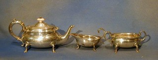 A Victorian 3 piece silver tea service of oval form raised on trifid feet comprising teapot, twin handled sugar basin and a cream jug, London 1896 24 ozs