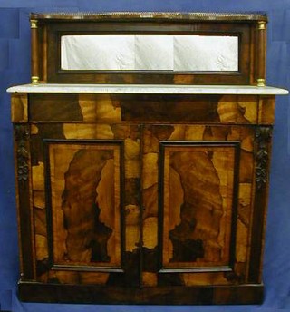 A fine quality Victorian rosewood chiffonier, with mirrored raised back and pierced brass thee-quarter gallery, the base fitted a drawer above double cupboard, raised on a platform base 44"